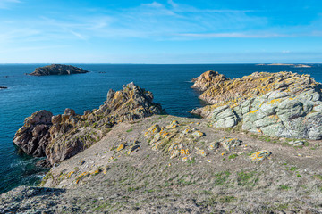 Fototapeta na wymiar View from Beg er Vachif peninsula in west of Houat island in French Brittany. Guric islet is at left background.
