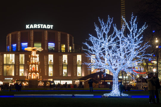 Traditional christmas market with illuminated tree in the center of Duisburg, Germany