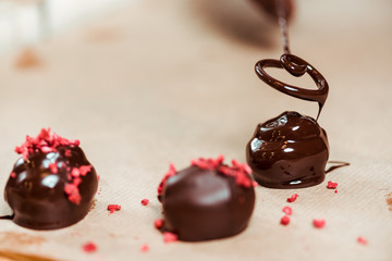 close up of dried raspberries on fresh made chocolate balls