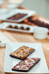 selective focus of delicious dark chocolate bars with different flavors