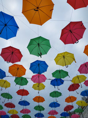 Fototapeta na wymiar Colorful umbrellas. Colorful umbrellas in the sky. Street decoration.