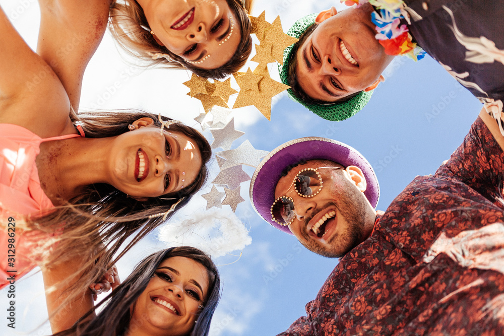 Wall mural brazilian carnival. group of brazilian people in costume celebrating the carnival party in the city