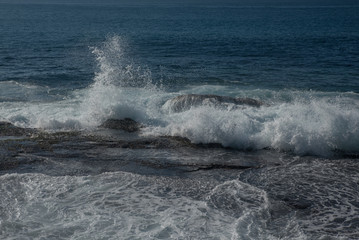 waves crashing on rocks