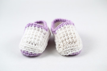 isolated hand sewn shoes for infants