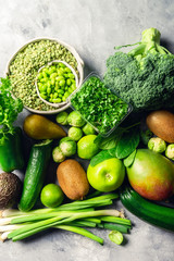 Variety of Green Vegetables and Fruits on the grey background