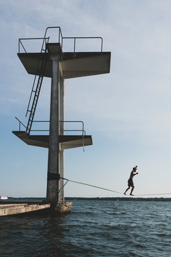 Person on slickline above sea