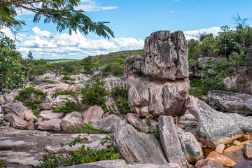 Piles of rocks in dry river inside brazilian tropical forest