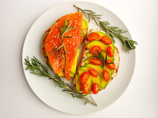 Healthy Eating. Useful Diet Toasts. Bruschetta with Avocado, Salmon and Cherry Tomatoes.