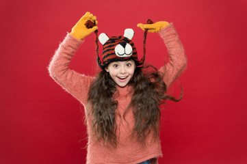 Cute accessories. Adorable baby wear cute winter knitted hat. Girl wear winter theme accessory. Fun and joy. Playful tiger. Festive spirit. Cheerful smiling kid. Playful cutie. Children seems cute