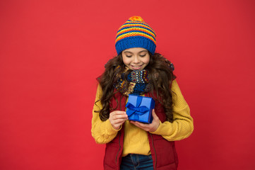 Shopping time. nice purchase. girl with new year present box. happy winter holidays. little girl knitted hat and scarf. merry christmas. xmas party mood. winter shopping sales. childhood happiness