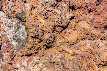 Volcanic melted rock relief structure lava background texture.