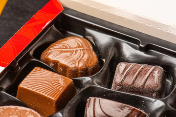 Old pralines with chocolate blooming.