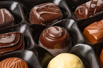 Old pralines with chocolate blooming.