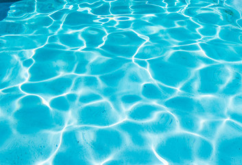 Fototapeta na wymiar Sun reflected in the water of a pool.