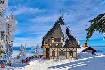 Poiana Brasov, Romania -16 January 2019:Wooden chalets and spectacular ski slopes in the...