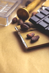 Tasty handmade chocolate on color background