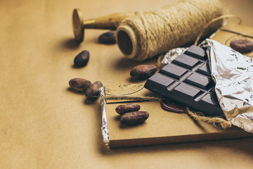 Tasty handmade chocolate on color background