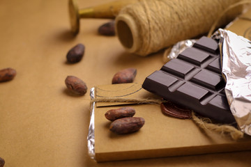 Tasty handmade chocolate on color background
