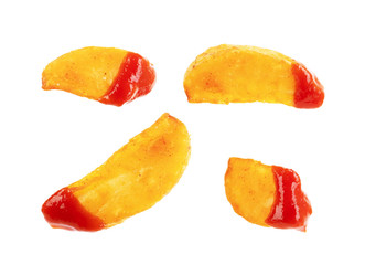 Set of french fries in sauce on a white plate