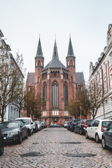 Obraz premium Backside facade of Paulskirche church with pointy towers in Schwerin near Hamburg, Germany