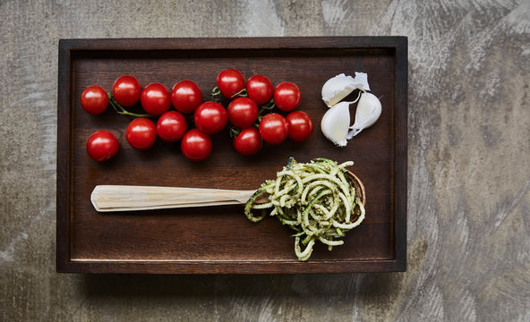 Pesto spaghetti, cherry tomatoes and garlic