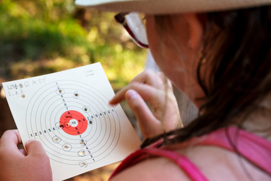 Girl checking shooting target