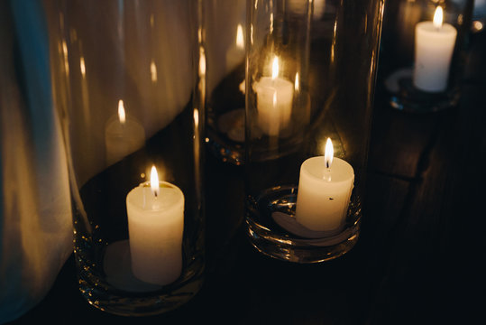 Candles in glass vases as decoration