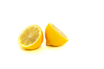Lemon on awhite background. Acid lemon used for tea. The concept of using a lemon.