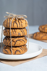 Oatmeal cookies on a gray wooden table.