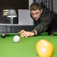 man playing pool