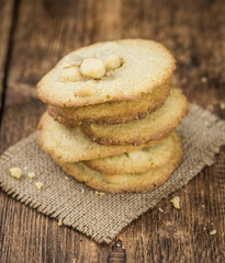 Some fresh Cookies on wooden background (selective focus; close-up shot)