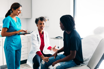 Male patient listening to doctor