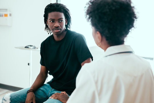 Male patient listening to doctor