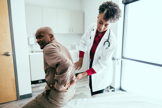 Doctor checks for pain and swelling