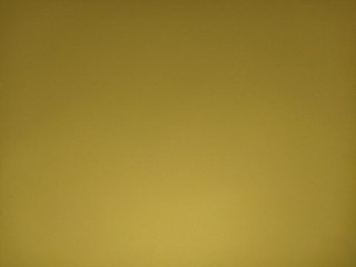 Yellow or ocher background. A dist of colored paper, dimly lit from below. The play of light and...