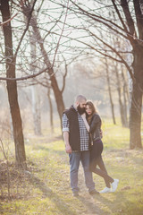 Hipster couple, girl with red hair and shaved bearded man