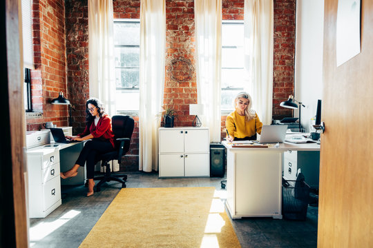 Coworkers working in modern office