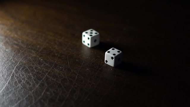 Rolling dice on the table 