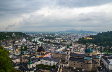 Fototapeta na wymiar View from Hohensalzburg Castle on the old historic center city of Salzburg including Mirabell palace, the Salzburg cathedral on a rainy day. Austria