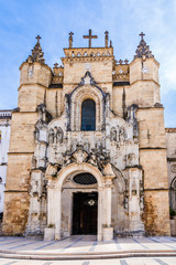 Fototapeta na wymiar Baroque decorations on the facade entrance of the Santa Cruz Momastery in Coimbra, Portugal: