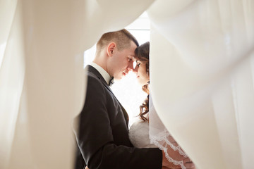 Fototapeta premium The first meeting of the bride and groom on the wedding day. Emotions newlyweds before the wedding ceremony.