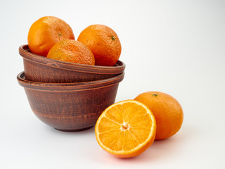 Tangerines or orange Mandarin fruit and peeled slices. A bunch of oranges and half.