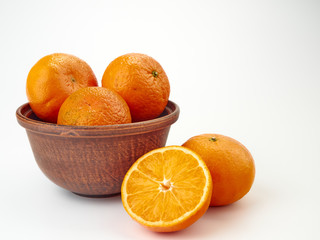 Tangerines or orange Mandarin fruit and peeled slices. A bunch of oranges and half.