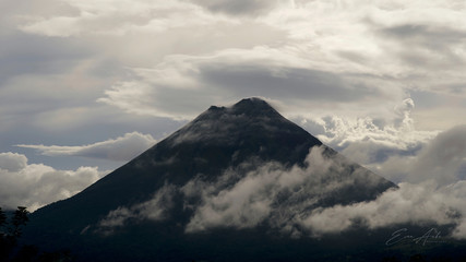 Arenal Volcano With Clouds Blue Sky Sunset © Evan