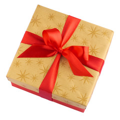 Red gift or present box with golden colored top and red ribbon bow isolated on white background