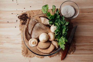 Mushrooms in a bowl on a table. food styling.