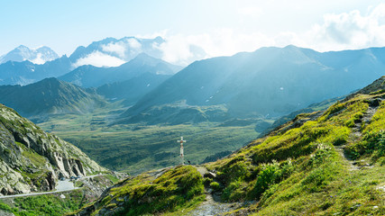 Fototapeta na wymiar View from the Great Saint Bernard Pass, on the green mountain pastures of Valais, Alps, Switzerland