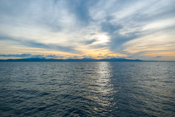 Fototapeta premium Ocean against a beautiful background of sunset sky