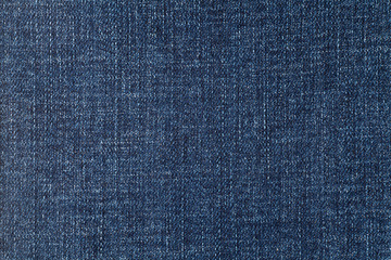 Background of blue denim fabric texture. Close-up.
