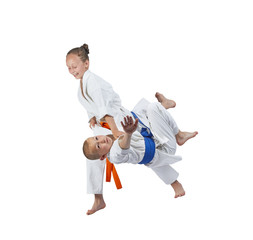 With orange belt girl is doing judo throw